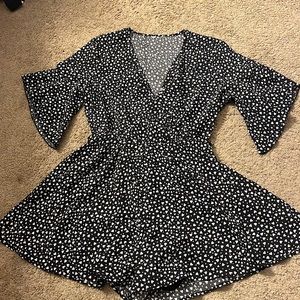Medium black and white romper with little white hearts zipped up in back.